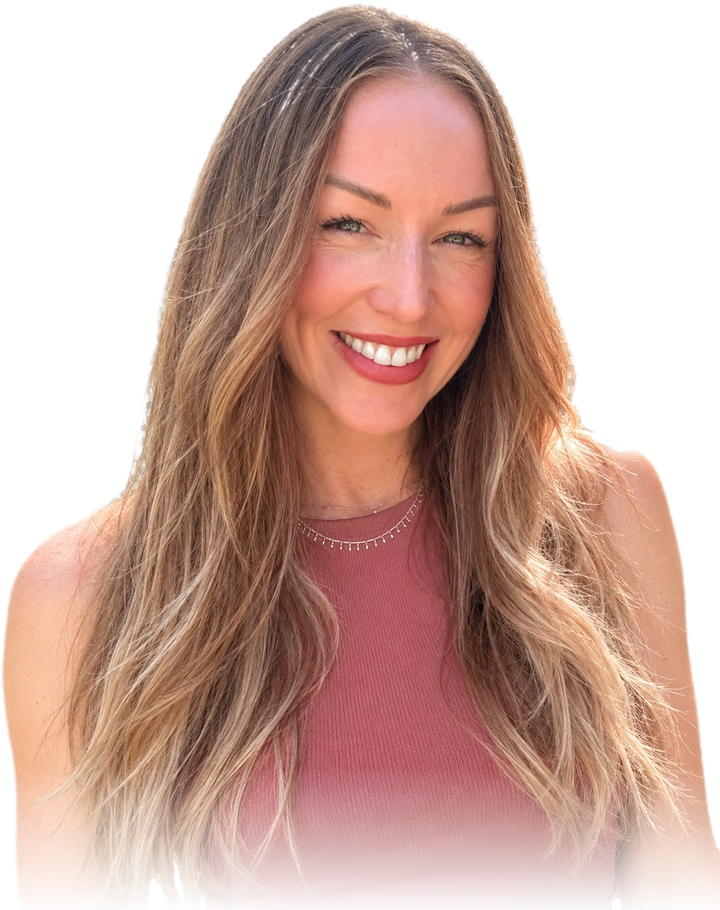 Rena smiling, with long wavy hair, in a rose-colored top